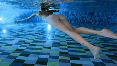 Relax time, public pool teasing actions underwater.