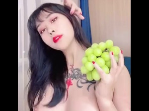 Chinese Girl and her Green Grapes!